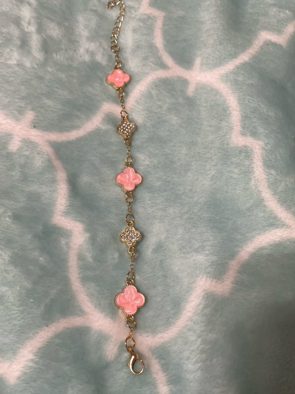 Gold tone Bracelet with Pink Clover Accents